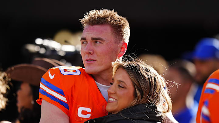 Denver Broncos quarterback Bo Nix (10) hugs wife, Izzy Nix
