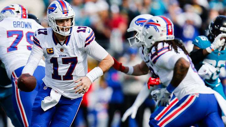 Buffalo Bills quarterback Josh Allen hands off to Buffalo Bills running back James Cook III against the Jaguars. Buffalo Bills quarterback Josh Allen hands off to Buffalo Bills running back James Cook III against the Jaguars.