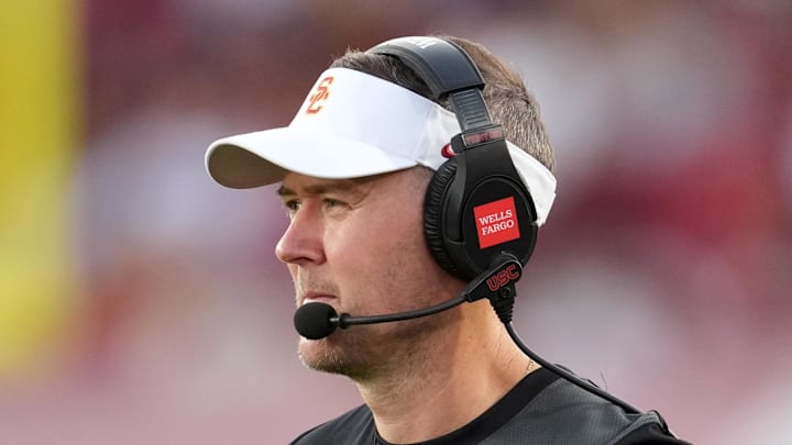 Aug 30, 2025; Los Angeles, California, USA; Southern California Trojans head coach Lincoln Riley watches from the sidelines against the Missouri State Bears in the first half at United Airlines Field at Los Angeles Memorial Coliseum. Mandatory Credit: Kirby Lee-Imagn Images