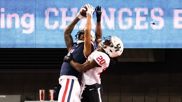 Nov 15, 2024; Tucson, Arizona, USA; Arizona Wildcats wide receiver Tetairoa McMillan (4) catches the ball to make a touchdown during the first quarter against the Houston Cougars at Arizona Stadium. 