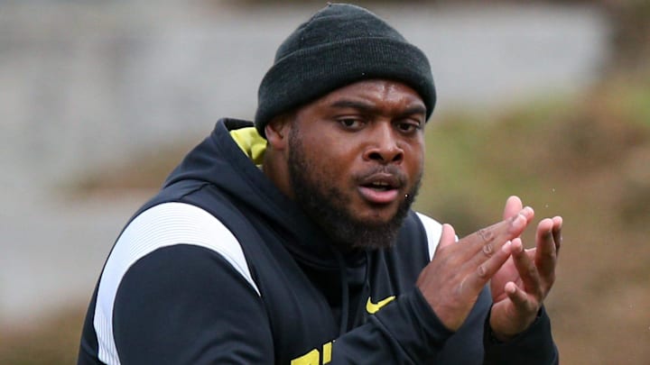 Oregon offensive line coach A'lique Terry leads a workout during spring practice with the Ducks in Eugene, Ore. Thursday, April, 13, 2023.

Sports Oregon Spring Practice
