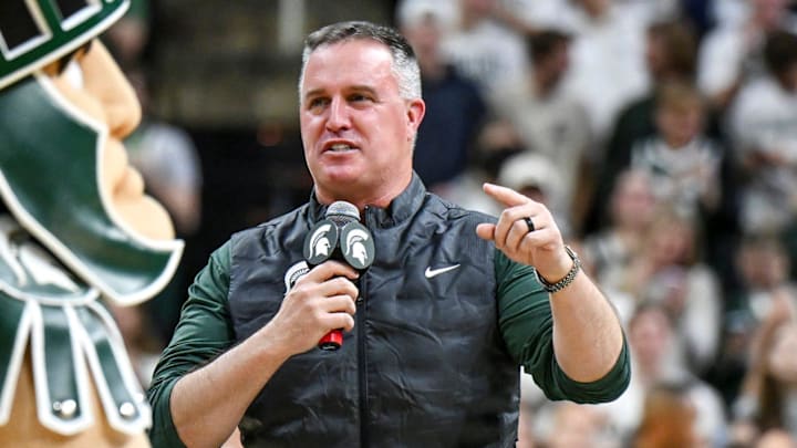 Michigan State's new football coach Pat Fitzgerald addresses the crowd during a timeout in the first half of the Spartans basketball game against Iowa on Tuesday, Dec. 2, 2025, at the Breslin Center in East Lansing. Michigan State's new football coach Pat Fitzgerald addresses the crowd during a timeout in the first half of the Spartans basketball game against Iowa on Tuesday, Dec. 2, 2025, at the Breslin Center in East Lansing.