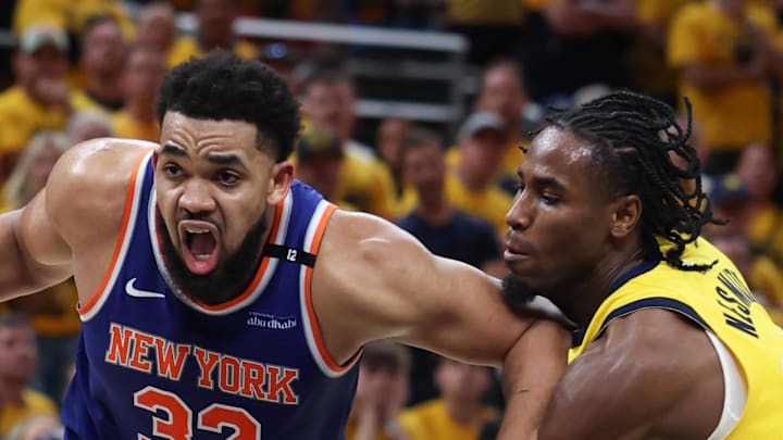 New York Knicks center Karl-Anthony Towns drives to the basket against Indiana Pacers guard Aaron Nesmith. New York Knicks center Karl-Anthony Towns drives to the basket against Indiana Pacers guard Aaron Nesmith.