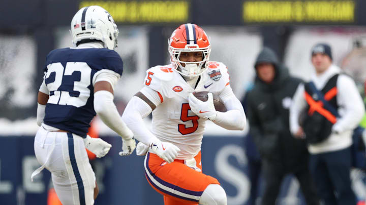 Dec 27, 2025; Bronx, NY, USA; Clemson Tigers tight end Josh Sapp (5) gains yards after catch as Penn State Nittany Lions cornerback Jahmir Joseph (23) pursues during the second half of the 2025 Pinstripe Bowl at Yankee Stadium. 