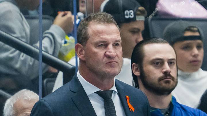 Sep 26, 2025; Vancouver, British Columbia, CAN; Vancouver Canucks head coach Adam Foote on the bench against the Seattle Kraken in the first period at Rogers Arena. Mandatory Credit: Bob Frid-Imagn Images