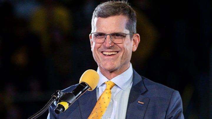 Michigan head coach Jim Harbaugh speaks during the national championship celebration at Crisler
