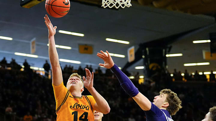 Iowa guard Bennett Stirtz (14) shoots the basketball against the Northwestern Wildcats Feb. 8, 2026 at Carver-Hawkeye Arena in Iowa City, Iowa.