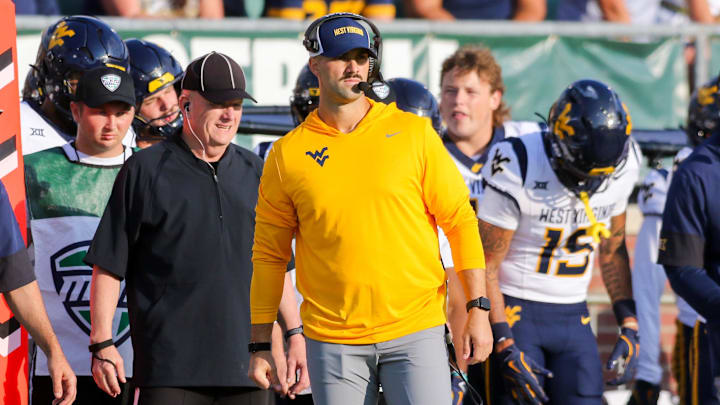 Sep 6, 2025; Athens, Ohio, USA; West Virginia Mountaineers defensive coordinator Zac Alley watches a play during the third quarter against the Ohio Bobcats at Peden Stadium. Mandatory Credit: Ben Queen-Imagn Images