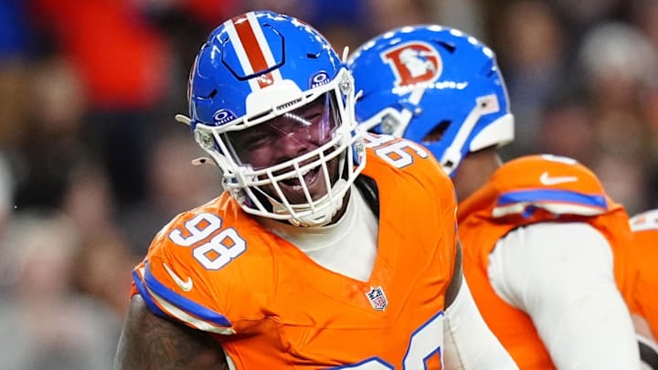 Nov 6, 2025; Denver, Colorado, USA; Denver Broncos defensive end John Franklin-Myers (98) reacts against the Las Vegas Raiders during the first half at Empower Field at Mile High. Mandatory Credit: Ron Chenoy-Imagn Images