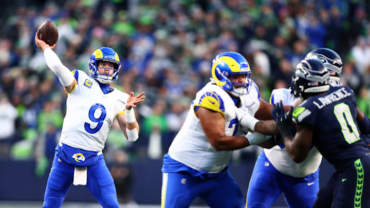 Jan 25, 2026; Seattle, WA, USA; Los Angeles Rams quarterback Matthew Stafford (9) passes against the Seattle Seahawks during the first half in the 2026 NFC Championship Game at Lumen Field. Mandatory Credit: Kevin Ng-Imagn Images