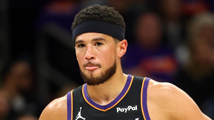 Apr 14, 2026; Phoenix, Arizona, USA; Phoenix Suns guard Devin Booker (1) reacts against the Portland Trail Blazers in the first half during the play-in rounds of the 2026 NBA Playoffs at Mortgage Matchup Center. Mandatory Credit: Mark J. Rebilas-Imagn Images