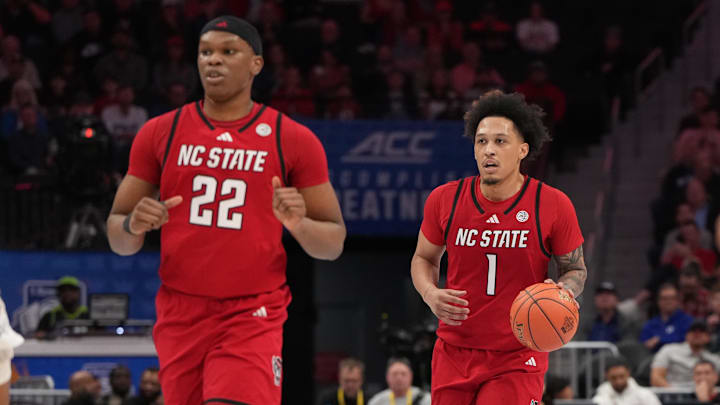 Mar 12, 2026; Charlotte, NC, USA; NC State Wolfpack forward Darrion Williams (1) brings the ball up the court in the first half at Spectrum Center. Mandatory Credit: Bob Donnan-Imagn Images