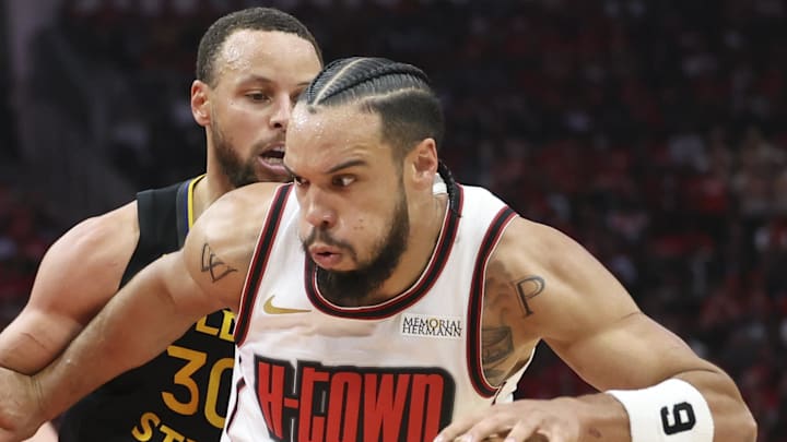 May 4, 2025; Houston, Texas, USA; Golden State Warriors guard Stephen Curry (30) defends as Houston Rockets forward Dillon Brooks (9) attempts to control the ball during game seven of the first round for the 2025 NBA Playoffs at Toyota Center. Mandatory Credit: Troy Taormina-Imagn Images
