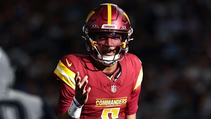 Oct 19, 2025; Arlington, Texas, USA; Washington Commanders quarterback Jayden Daniels (5) calls a play at the line of scrimmage against the Dallas Cowboys =d2q of the game at AT&T Stadium. Mandatory Credit: Kevin Jairaj-Imagn Images