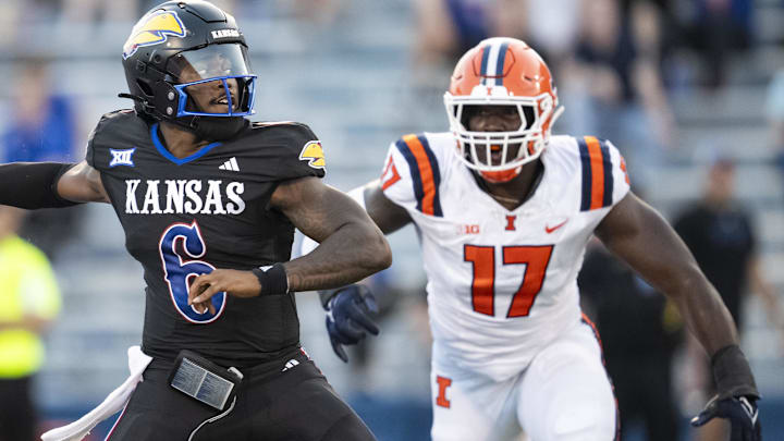 Sep 8, 2023; Lawrence, Kansas, USA; Kansas Jayhawks quarterback Jalon Daniels (6) throws a pass against Illinois Fighting Illini linebacker Gabe Jacas (17) during the first half at David Booth Kansas Memorial Stadium. Mandatory Credit: Jay Biggerstaff-Imagn Images