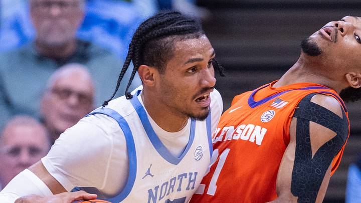 Mar 3, 2026; Chapel Hill, North Carolina, USA; North Carolina Tar Heels forward Jarin Stevenson (15) drives through Clemson Tigers guard Ace Buckner (21) during the first half at Dean E. Smith Center. Mandatory Credit: Scott Kinser-Imagn Images Mar 3, 2026; Chapel Hill, North Carolina, USA; North Carolina Tar Heels forward Jarin Stevenson (15) drives through Clemson Tigers guard Ace Buckner (21) during the first half at Dean E. Smith Center. Mandatory Credit: Scott Kinser-Imagn Images