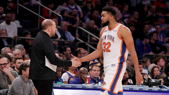 Jan 10, 2025; New York, New York, USA; New York Knicks center Karl-Anthony Towns (32) shakes hands with New York Knicks head coach Tom Thibodeau as he exits the game during the third quarter against the Oklahoma City Thunder at Madison Square Garden. Mandatory Credit: Brad Penner-Imagn Images