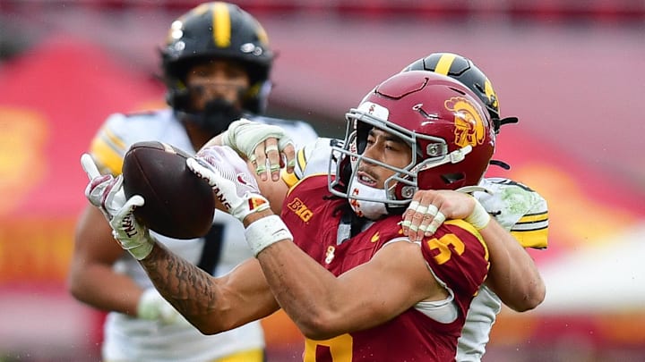 Nov 15, 2025; Los Angeles, California, USA; Southern California Trojans wide receiver Makai Lemon (6) catches a pass against the defense of Iowa Hawkeyes defensive back Zach Lutmer (6) during the second half at the Los Angeles Memorial Coliseum. 