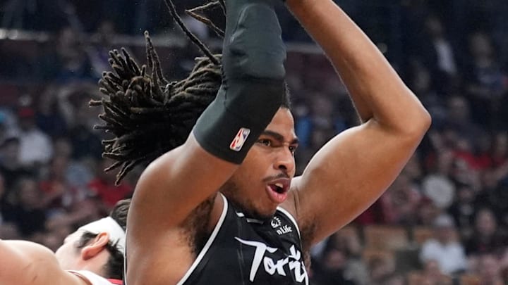 Toronto Raptors forward Collin Murray-Boyles rebounds the ball against Miami Heat forward Jaime Jaquez Jr. Toronto Raptors forward Collin Murray-Boyles rebounds the ball against Miami Heat forward Jaime Jaquez Jr.