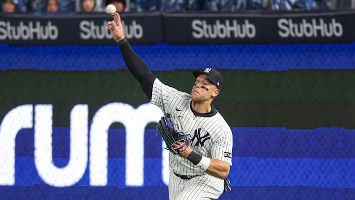 Apr 11, 2025; Bronx, New York, USA; New York Yankees right fielder Aaron Judge (99) throws the ball during the fourth inning against the San Francisco Giants at Yankee Stadium. 