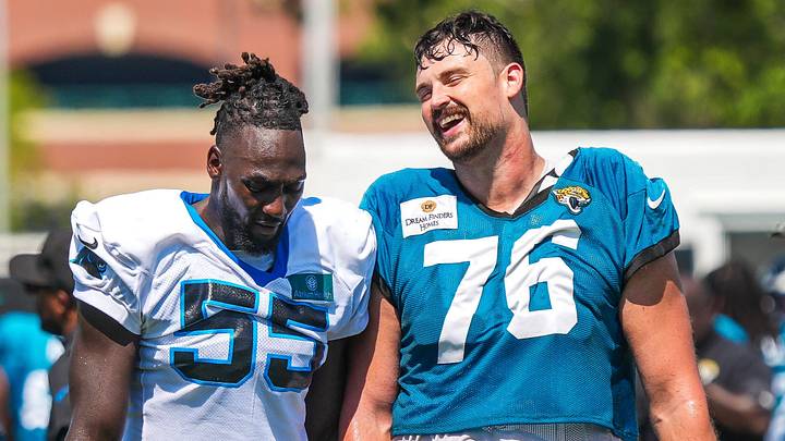 Carolina Panthers linebacker Devin Lloyd (55) has a laugh with Jacksonville Jaguars guard Ezra Cleveland (76) after a joint practice with the Carolina Panthers on the 16th session of NFL training camp at the Miller Electric Center on Wednesday, Aug. 19, 2026, in Jacksonville, Fla. [Doug Engle/Florida Times-Union]