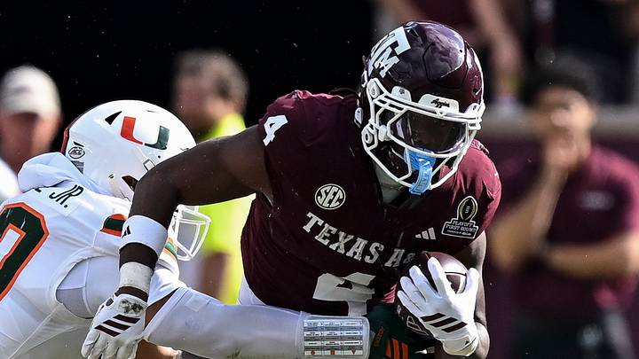Texas A&M Aggies running back Rueben Owens II (4) runs the ball as Miami Hurricanes linebacker Raul Aguirre Jr. (10) defends during the second half at Kyle Field. Texas A&M Aggies running back Rueben Owens II (4) runs the ball as Miami Hurricanes linebacker Raul Aguirre Jr. (10) defends during the second half at Kyle Field.