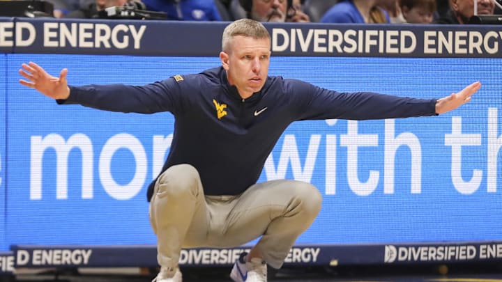 Feb 28, 2026; Morgantown, West Virginia, USA; West Virginia Mountaineers head coach Ross Hodge watched a play from the sideline during the first half against the BYU Cougars at Hope Coliseum. Mandatory Credit: Ben Queen-Imagn Images