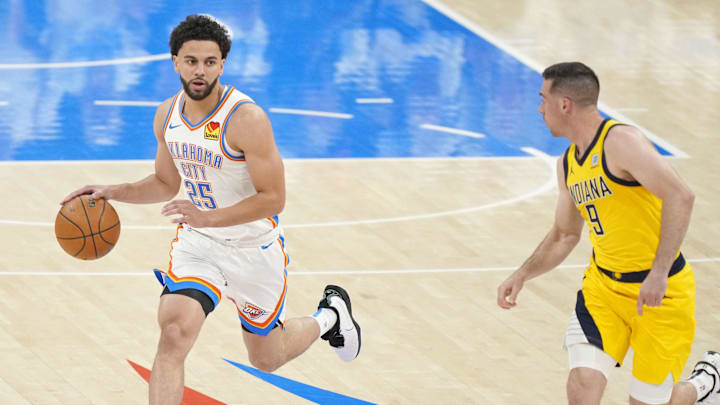 Jun 5, 2025; Oklahoma City, Oklahoma, USA; Oklahoma City Thunder guard Ajay Mitchell (25) dribbles the ball against Indiana Pacers guard T.J. McConnell (9) during the first quarter in game one of the 2025 NBA Finals at Paycom Center. Mandatory Credit: Kyle Terada-Imagn Images