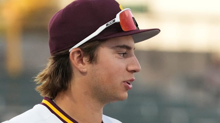 Arizona State baseball players PJ Moutzouridis (10) and Landon Hairston (3) chat during their game against the New Mexico State Aggies at Phoenix Municipal Stadium on March 25, 2026. Arizona State baseball players PJ Moutzouridis (10) and Landon Hairston (3) chat during their game against the New Mexico State Aggies at Phoenix Municipal Stadium on March 25, 2026.