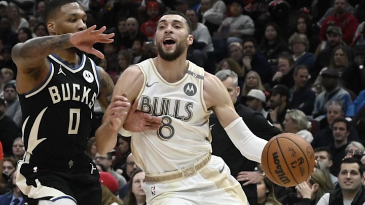 Dec 28, 2024; Chicago, Illinois, USA; Chicago Bulls guard Zach LaVine (8) dribbles against Milwaukee Bucks guard Damian Lillard (0) during the first half at the United Center. Mandatory Credit: Matt Marton-Imagn Images Dec 28, 2024; Chicago, Illinois, USA; Chicago Bulls guard Zach LaVine (8) dribbles against Milwaukee Bucks guard Damian Lillard (0) during the first half at the United Center. Mandatory Credit: Matt Marton-Imagn Images