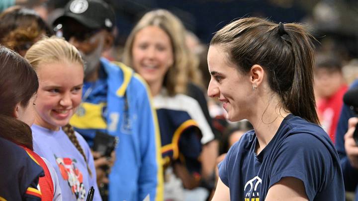 Indiana Fever guard Caitlin Clark signs autographs for fans prior to a game against the Chicago Sky. Indiana Fever guard Caitlin Clark signs autographs for fans prior to a game against the Chicago Sky.