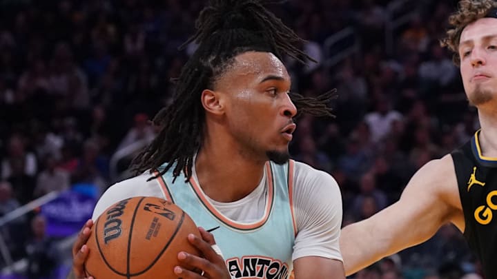 Apr 9, 2025; San Francisco, California, USA; San Antonio Spurs guard Stephon Castle (5) dribbles against Golden State Warriors guard Brandin Podziemski (2) and forward Jimmy Butler III (10) in the fourth quarter at Chase Center. Mandatory Credit: David Gonzales-Imagn Images Apr 9, 2025; San Francisco, California, USA; San Antonio Spurs guard Stephon Castle (5) dribbles against Golden State Warriors guard Brandin Podziemski (2) and forward Jimmy Butler III (10) in the fourth quarter at Chase Center. Mandatory Credit: David Gonzales-Imagn Images