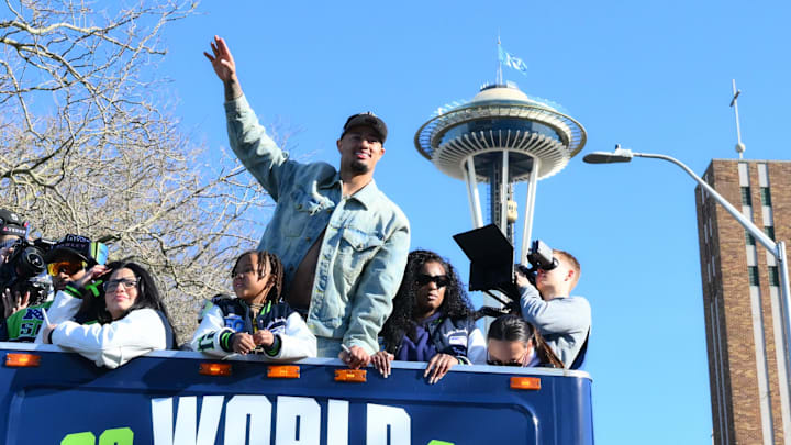 Feb 11, 2026; Seattle, WA, USA; Seattle Seahawks wide receiver Jaxon Smith-Njigba (11)  interacts with fans during the Super Bowl LX World Champions parade in downtown Seattle. Mandatory Credit: Steven Bisig-Imagn Images