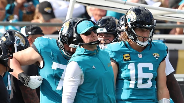 Dec 14, 2025; Jacksonville, Florida, USA; Jacksonville Jaguars head coach Liam Coen stands with quarterback Trevor Lawrence (16) during the second quarter against the New York Jets at EverBank Stadium. Mandatory Credit: Morgan Tencza-Imagn Images