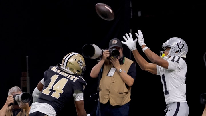 Dec 29, 2024; New Orleans, Louisiana, USA; Las Vegas Raiders wide receiver Tre Tucker (11) scores a touchdown against New Orleans Saints cornerback Kool-Aid McKinstry (14) during the fourth quarter at Caesars Superdome. Mandatory Credit: Matthew Hinton-Imagn Images Dec 29, 2024; New Orleans, Louisiana, USA; Las Vegas Raiders wide receiver Tre Tucker (11) scores a touchdown against New Orleans Saints cornerback Kool-Aid McKinstry (14) during the fourth quarter at Caesars Superdome. Mandatory Credit: Matthew Hinton-Imagn Images