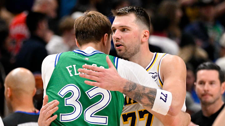 Jan 24, 2026; Dallas, Texas, USA; Los Angeles Lakers guard Luka Doncic (77) hugs Dallas Mavericks forward Cooper Flagg (32) after the game at the American Airlines Center. Mandatory Credit: Jerome Miron-Imagn Images