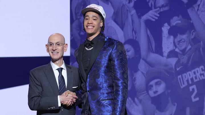 Yanic Konan Niederhauser stands with NBA commissioner Adam Silver
