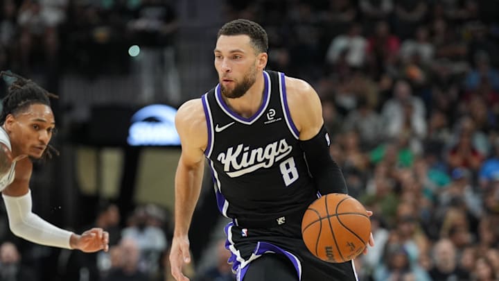 Nov 16, 2025; San Antonio, Texas, USA; Sacramento Kings guard Zach LaVine (8) dribbles in the second half against the San Antonio Spurs at Frost Bank Center.