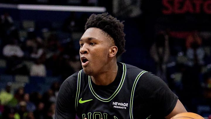 Dec 8, 2025; New Orleans, Louisiana, USA; New Orleans Pelicans center Derik Queen (22) dribbles against San Antonio Spurs center/forward Luke Kornet (7) during the second half at Smoothie King Center. Mandatory Credit: Stephen Lew-Imagn Images Dec 8, 2025; New Orleans, Louisiana, USA; New Orleans Pelicans center Derik Queen (22) dribbles against San Antonio Spurs center/forward Luke Kornet (7) during the second half at Smoothie King Center. Mandatory Credit: Stephen Lew-Imagn Images