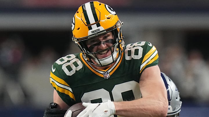 Jan 14, 2024; Arlington, Texas, USA; Green Bay Packers tight end Luke Musgrave (88) is tackled by Dallas Cowboys linebacker Damone Clark (33) after a reception during the first quarter in a 2024 NFC wild card game at AT&T Stadium. Mandatory Credit: Mark Hoffman-Imagn Images