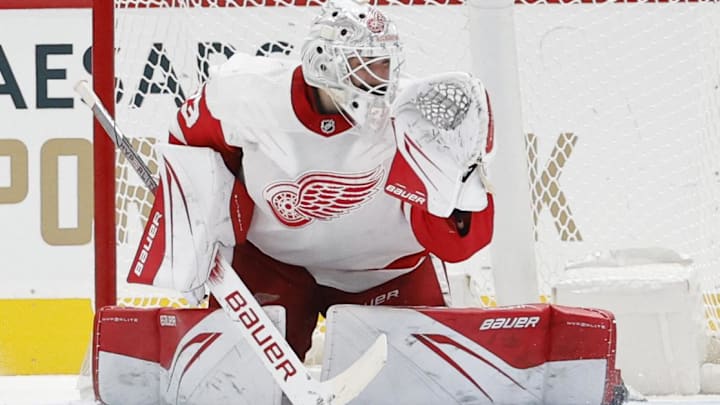 Sep 28, 2023; Washington, District of Columbia, USA; Washington Capitals right wing T.J. Oshie (77) scores a goal on Detroit Red Wings goaltender Sebastian Cossa (33) during a shootout at Capital One Arena. Mandatory Credit: Geoff Burke-Imagn Images