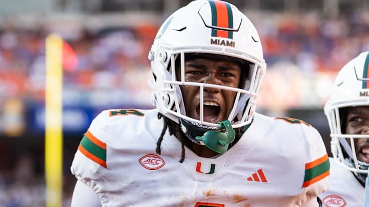 Aug 31, 2024; Gainesville, Florida, USA; Miami Hurricanes running back Mark Fletcher Jr. (4) and Miami Hurricanes tight end Elija Lofton (9) celebrate after a touchdown against the Florida Gators during the second half at Ben Hill Griffin Stadium. Mandatory Credit: Matt Pendleton-Imagn Images