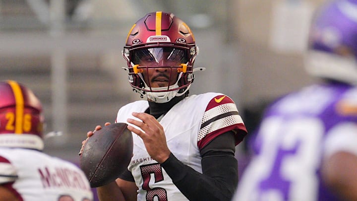 Dec 7, 2025; Minneapolis, Minnesota, USA; Washington Commanders quarterback Jayden Daniels (5) drops back to pass against the Minnesota Vikings during the first half at U.S. Bank Stadium. Mandatory Credit: Brad Rempel-Imagn Images