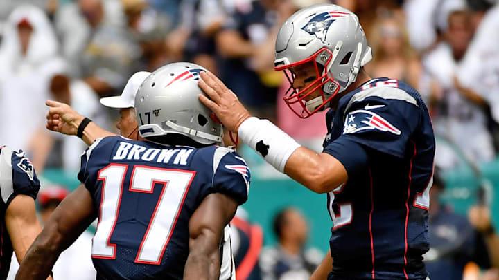 Sep 15, 2019; Miami Gardens, FL, USA; New England Patriots quarterback Tom Brady (12) congratulates wide receiver Antonio Brown (17) during the first half against the Miami Dolphins at Hard Rock Stadium. Mandatory Credit: Jasen Vinlove-Imagn Images Sep 15, 2019; Miami Gardens, FL, USA; New England Patriots quarterback Tom Brady (12) congratulates wide receiver Antonio Brown (17) during the first half against the Miami Dolphins at Hard Rock Stadium. Mandatory Credit: Jasen Vinlove-Imagn Images