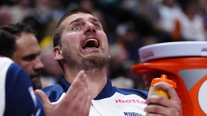 Apr 29, 2025; Denver, Colorado, USA; Denver Nuggets center Nikola Jokic (15) reacts from the bench in the fourth quarter against the LA Clippers during game five of the first round for the 2025 NBA Playoffs at Ball Arena. Mandatory Credit: Ron Chenoy-Imagn Images
