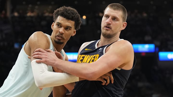 Jan 4, 2025; San Antonio, Texas, USA; San Antonio Spurs center Victor Wembanyama (1) and Denver Nuggets center Nikola Jokic (15) battle for position during an inbound pass in the second half at Frost Bank Center. Mandatory Credit: Scott Wachter-Imagn Images