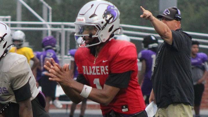 Ridge View quarterback Tre Howard prepares to receive a snap during a preseason practice.