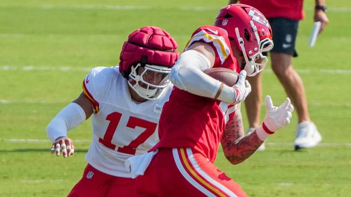 Aug 3, 2026; Kansas City, MO, USA; Kansas City Chiefs   tight end Jared Wiley (12) catches a pass as Kansas City Chiefs linebacker Jeffrey Bassa (31) defends during training camp at Missouri Western University. Mandatory Credit: Denny Medley-Imagn Images
