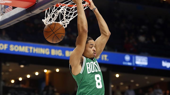 Oct 8, 2025; Memphis, Tennessee, USA; Boston Celtics forward Josh Minott (8) dunks during the second quarter against the Memphis Grizzlies at FedExForum. Mandatory Credit: Petre Thomas-Imagn Images