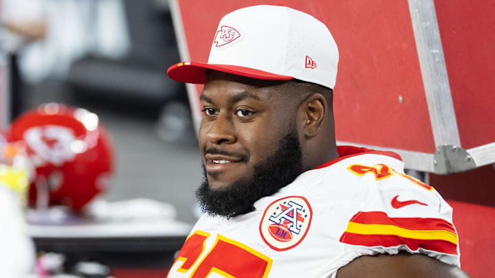 Aug 9, 2025; Glendale, Arizona, USA; Kansas City Chiefs guard Trey Smith (65) against the Arizona Cardinals during a preseason NFL game at State Farm Stadium.